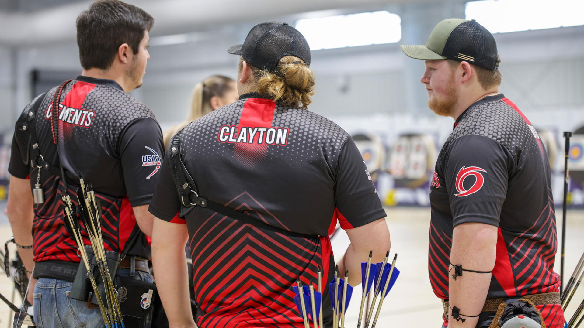 Rio Grande's Daniel Clayton talks with two of his teammates during action at the USA Archery Indoor Nationals in Penn Laird, Va.