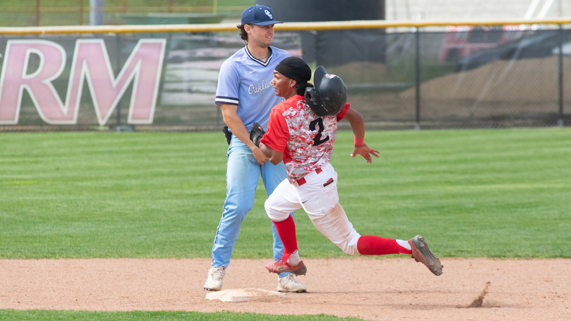 Rio Grande's Joel Pagan loses his helmet while rounding second base during Monday afternoon's 7-3 win over Oakland City University at Bob Evans Field.