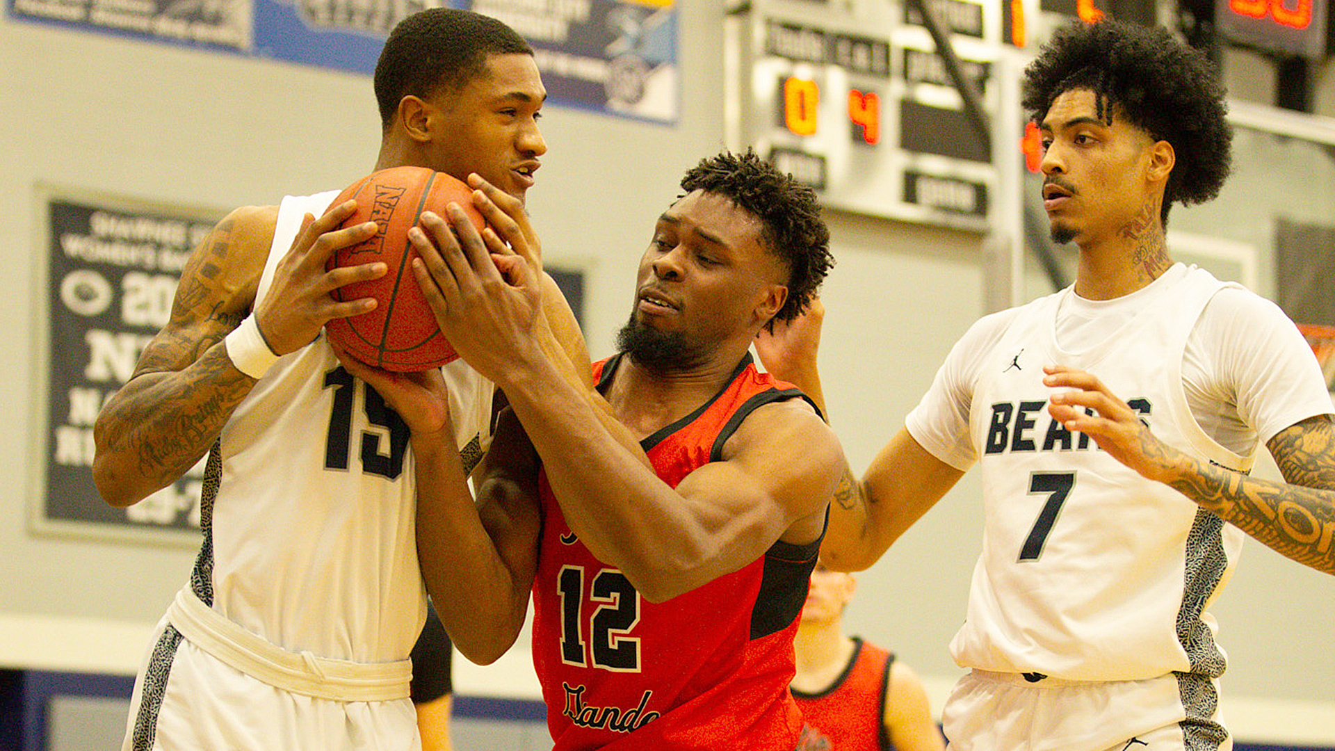 Rio Grande's Jaelin Johnson battlles a pair of Shawnee State players for a rebound during Tuesday night's 84-79 loss to the Bears in Portsmouth, Ohio.