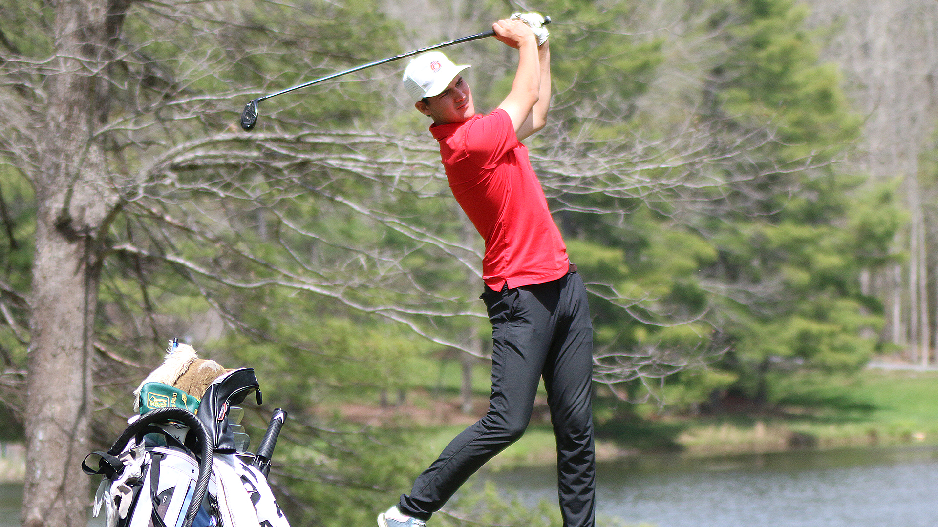 Rio's Pedro Torrens watches the flight of his shot at the RSC Men's Golf Championship in Daniels, W.Va.