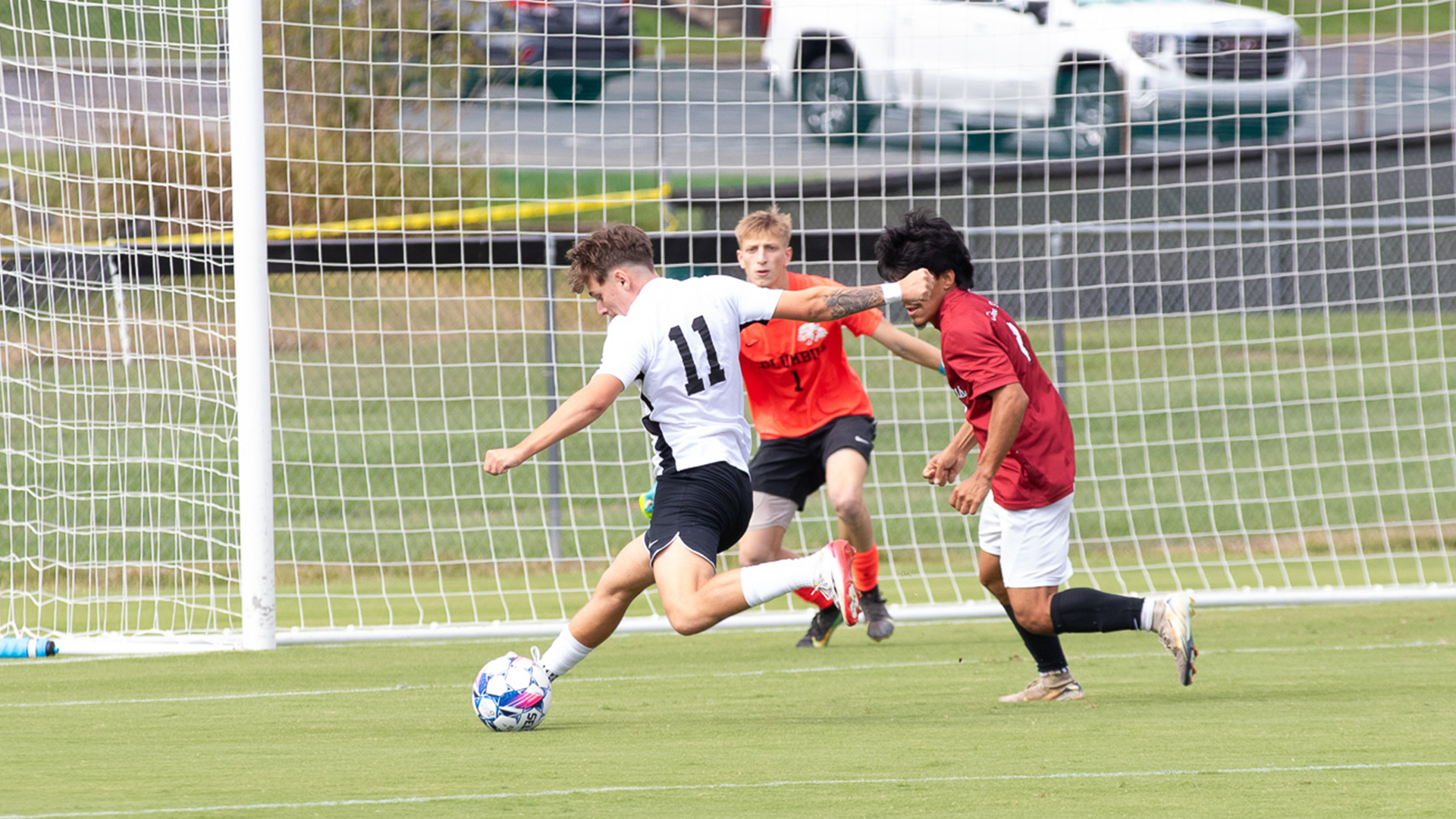 Rio Grande's Lucas O'Donnell takes aim at the goal as two Indiana University Columbus defenders converge during Saturday's 6-0 win over the Crimson Pride at Evan E. Davis Field.