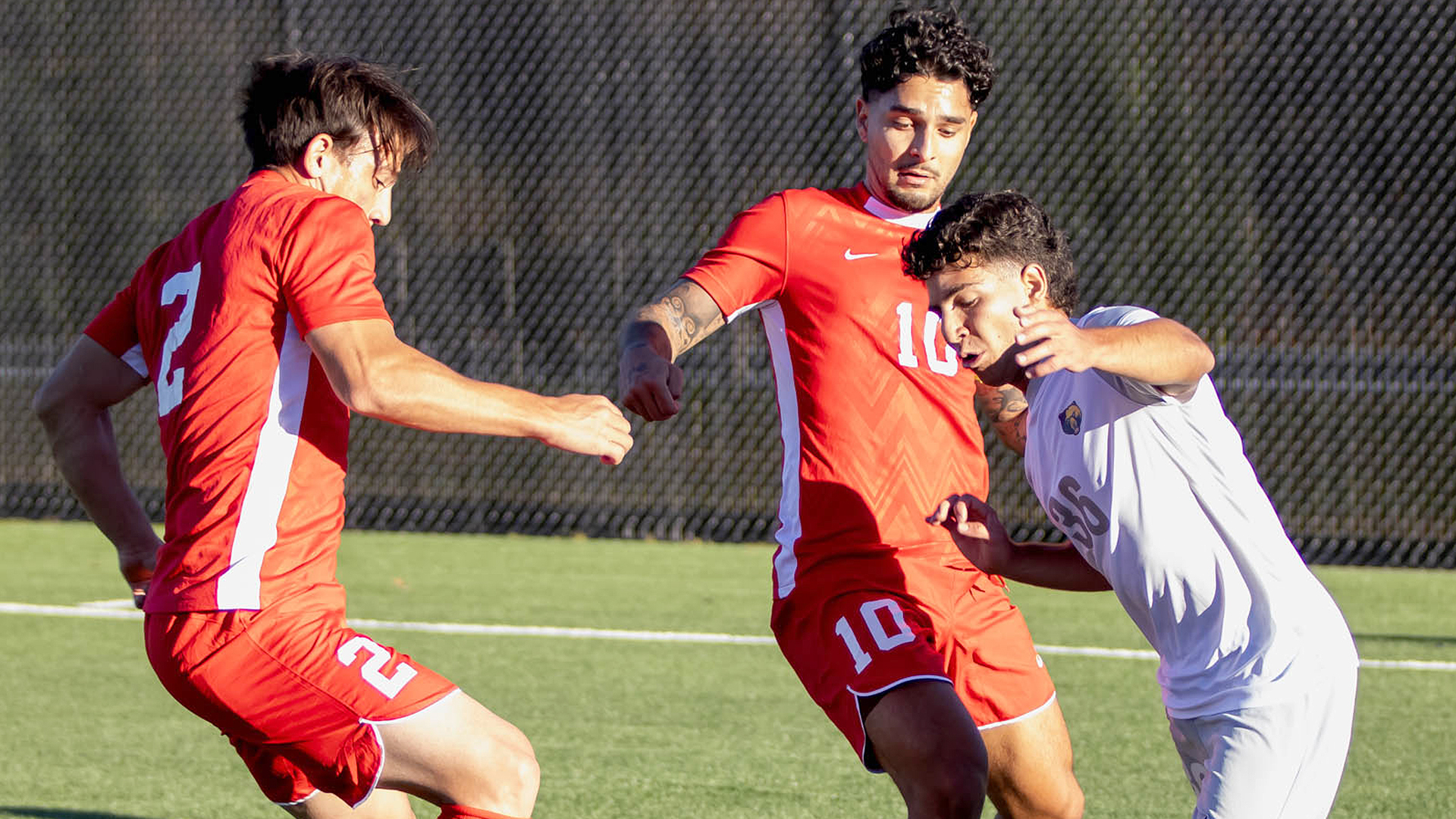 Rio Grande's Allen Julian (2) and Justin Jimenez (10) converge on WVU Tech's Benjamin Niles for control of the ball in Thursday night's 4-1 loss to the Golden Bears in Beckley, W.Va.