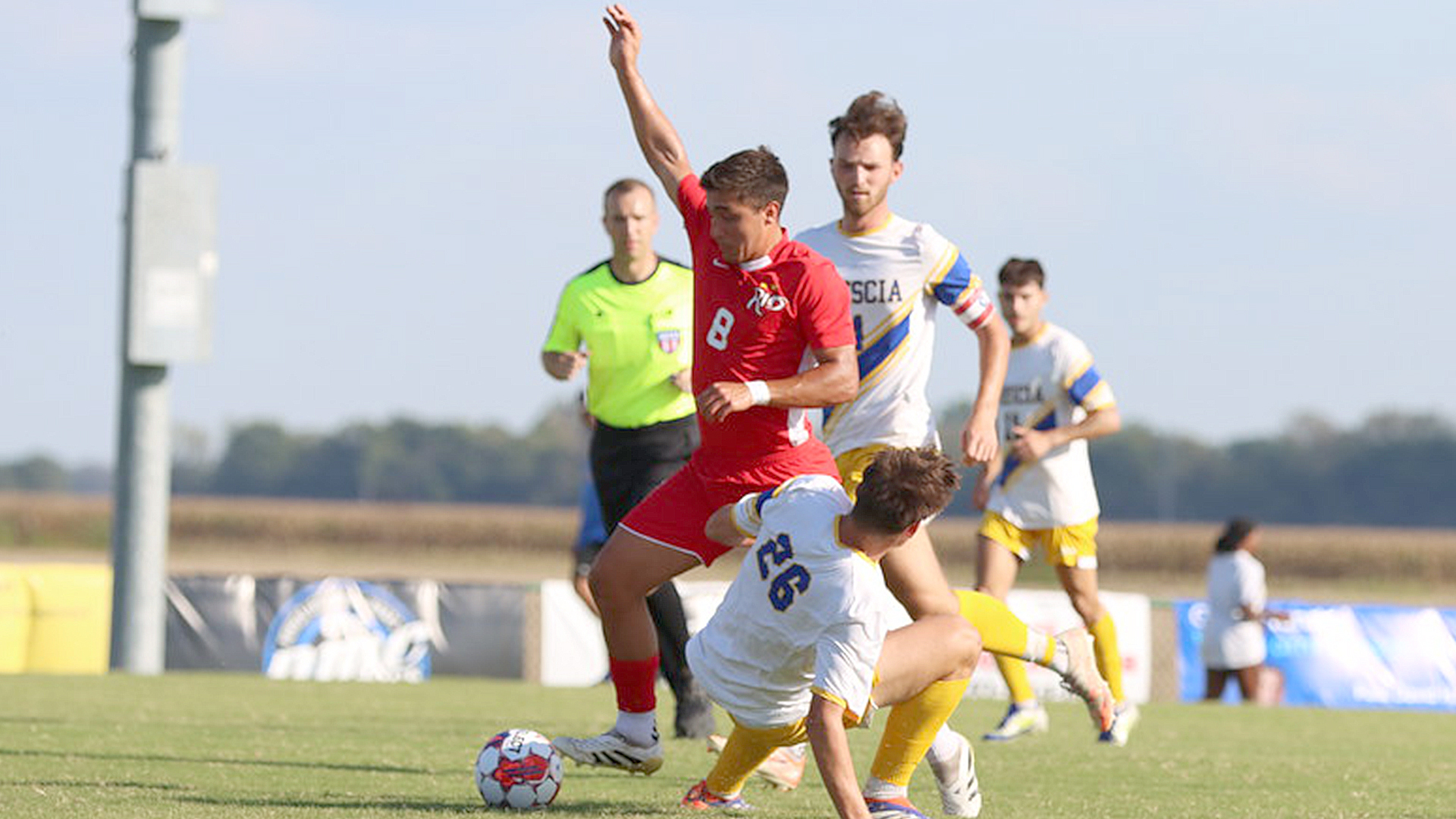 Rio Grande's Nahuel Coppiz works between a pair of Brescia defenders during Saturday's 3-1 win over the Bearcats in Owensboro, Ky.
