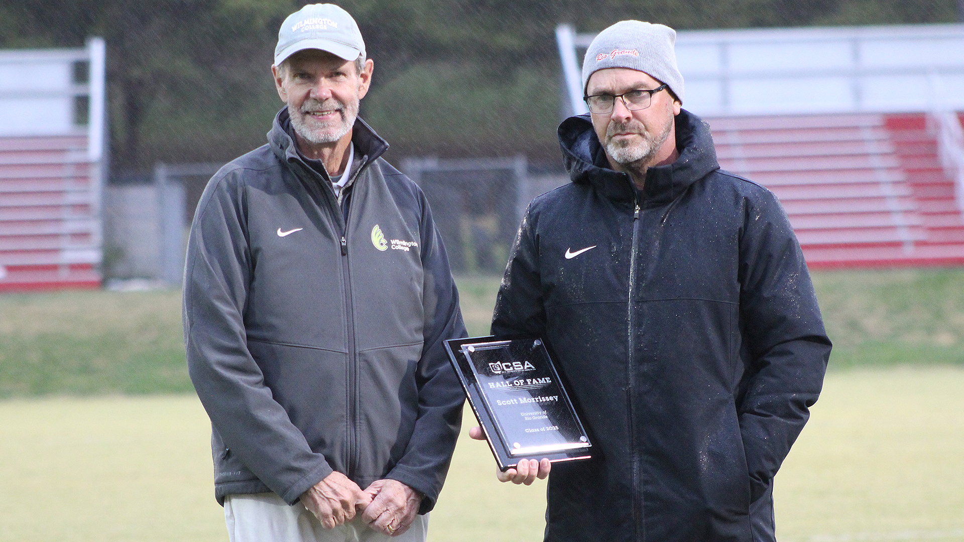 Bud Lewis, representing the Ohio Collegiate Soccer Association, presents University of Rio Grande men's soccer head coach Scott Morrissey with his Hall of Fame plaque as part of the OCSA's Class of 2025.