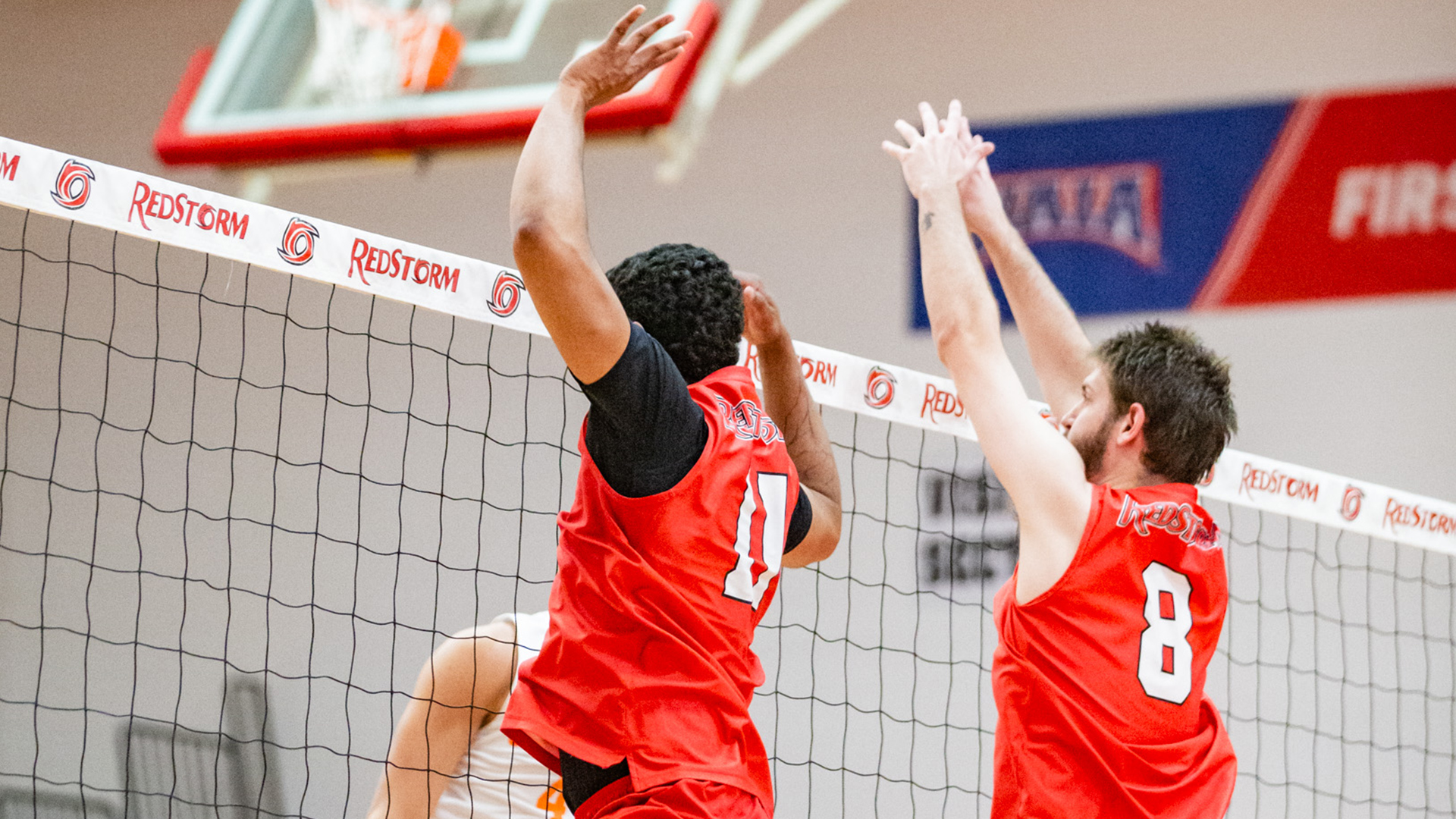 Rio's Daniel Rivas (11) and Josef Iten (8) attempt to block a Georgetown attack during Tuesday night's loss to the Tigers at the Newt Oliver Arena.