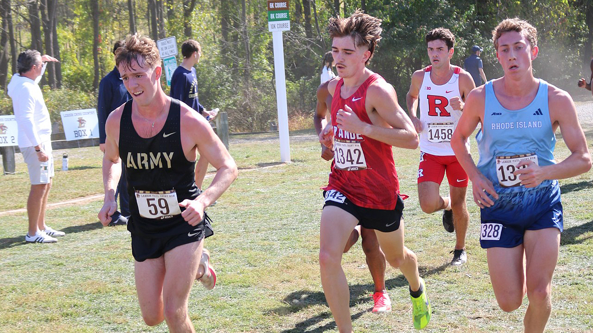 Rio Grande's Ryder Crawford runs in between athletes from NCAA Division I Army, Rhode Island and Rutgers during Friday's Paul Short Run hosted by Lehigh University in Bethlehem, Pa.