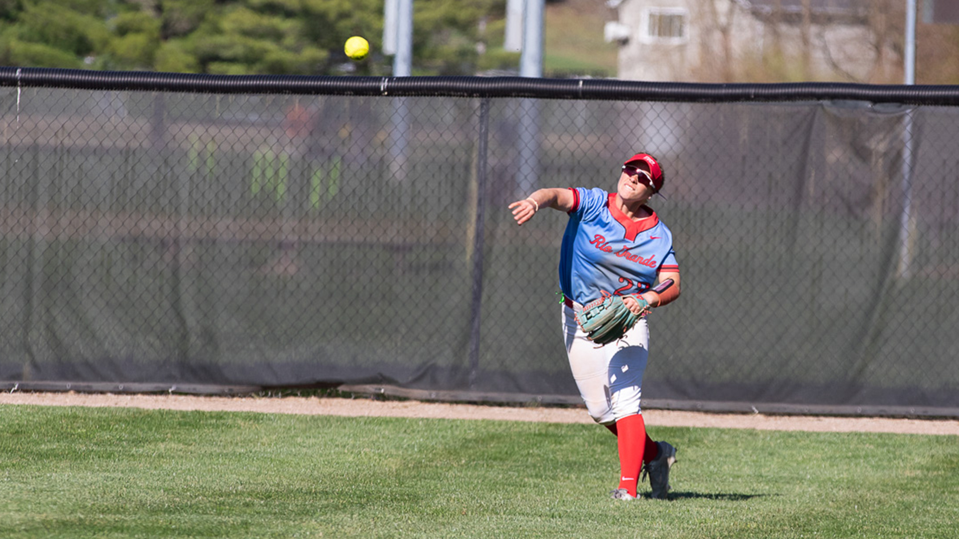 Rio Grande center fielder Emily Lane fires a ball back toward the infield during Saturday's game one win over Kentucky Christian University at Rio Softball Park. The RedStorm swept the twin bill by scores of 10-7 and 7-4.