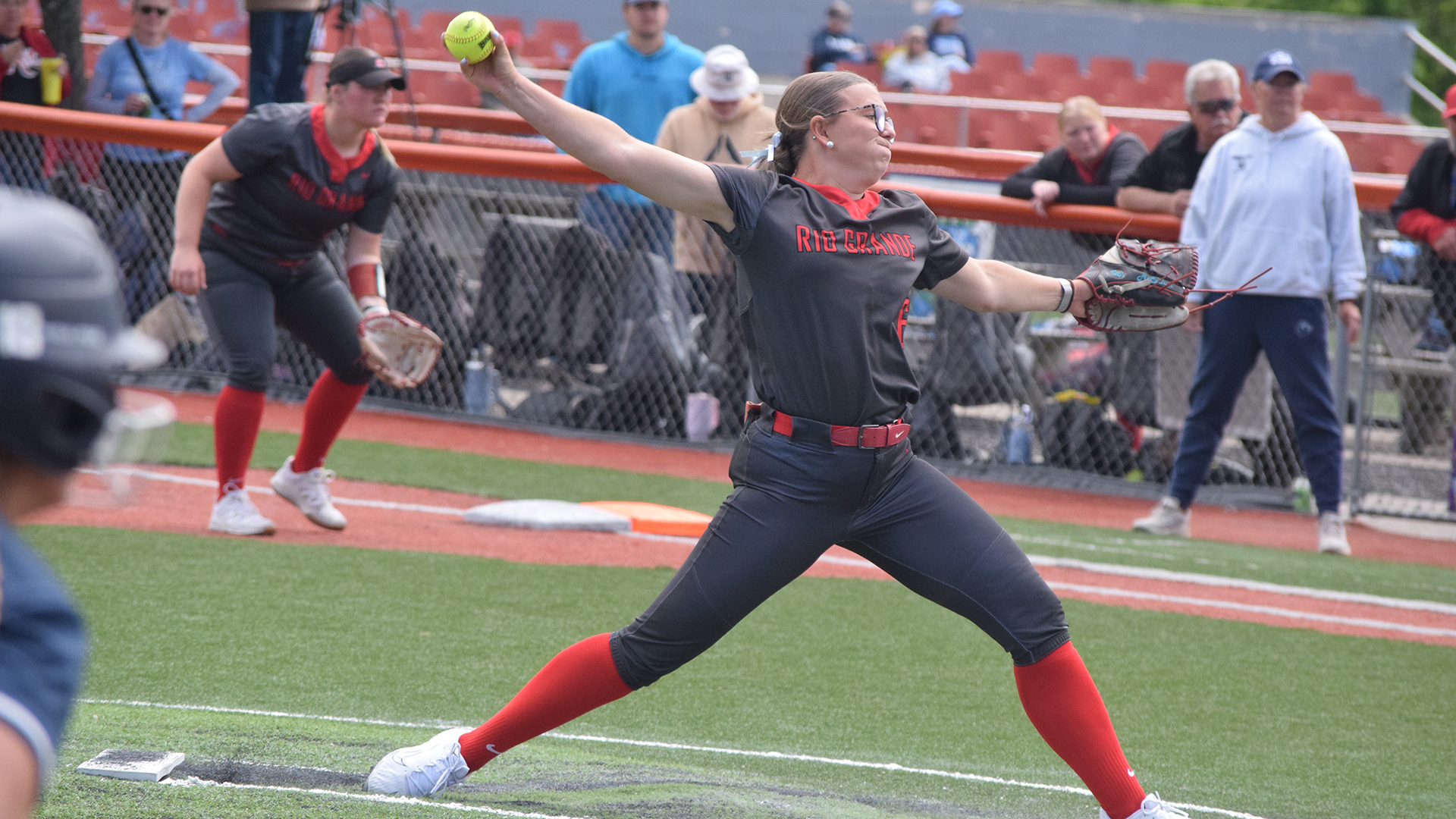Rio Grande's Meg McCallum throws a pitch plateward during Friday's win over rival Shawnee State University in the River States Conference Softball Championship at Little Creek Park in South Charleston, W.Va.