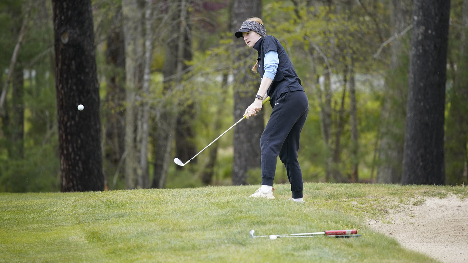 Rio Grande's Natalie Shriner chips toward the green during Monday's second round of the River States Conference Women's Golf Championship in Daniels, W.Va.