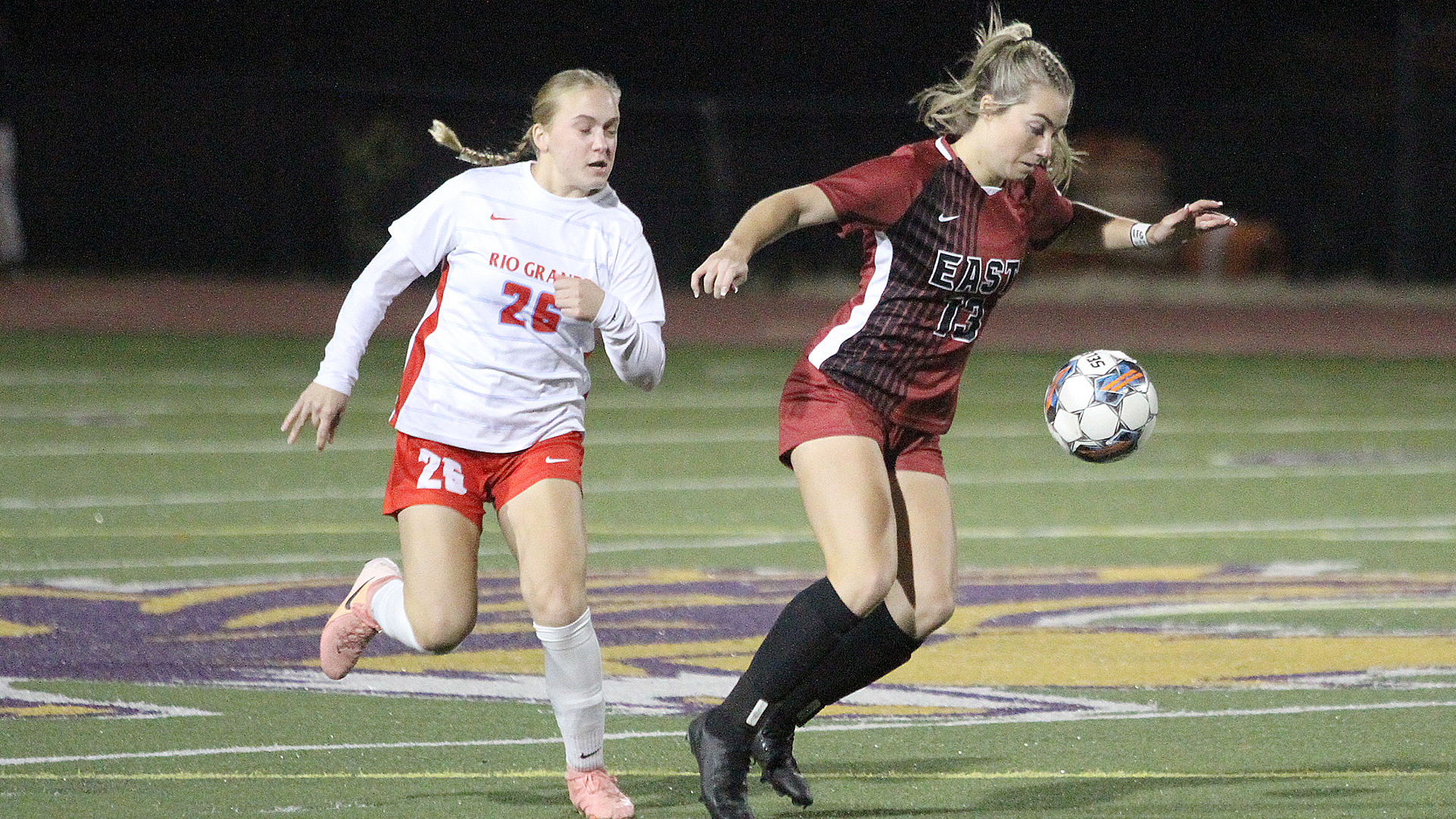 Rio Grande's Stephanie Beaulieu and IU East's Ava Wittrock battle for control of the ball during the first half of Wednesday night's River States Conference Championship quarterfinal round game in Eaton, Ohio. The Red Wolves defeated the RedStorm, 1-0.