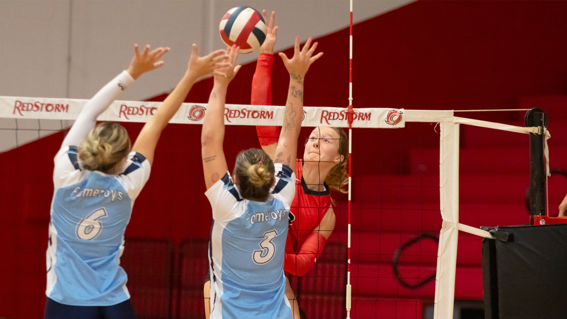 Rio Grande's Taylor Bartrum sends an attack over two St. Mary-of-the-Woods College defenders during Friday's 3-1 loss to the Pomeroys at the Newt Oliver Arena.