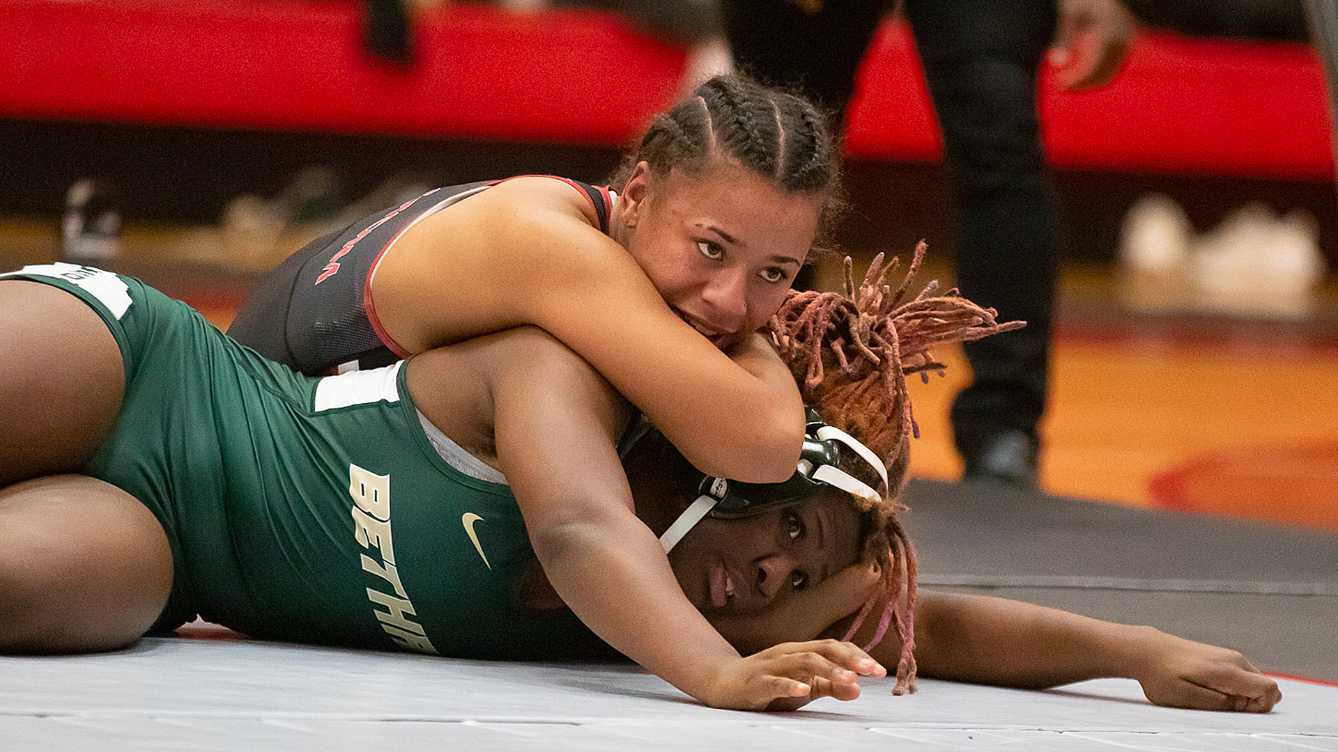 Rio Grande's Kara Bebout battles Bethany's Jasmine Craddock in their 145-pound match during Monday night's action at the Newt Oliver Arena.